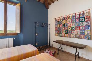 A bed or beds in a room at La Ripa - Appartamento I Ghiri