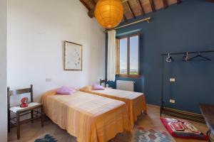 A bed or beds in a room at La Ripa - Appartamento I Ghiri