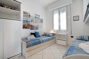 a bedroom with two beds and a window at Relaxing Sea View in Lido di Jesolo +26 photos