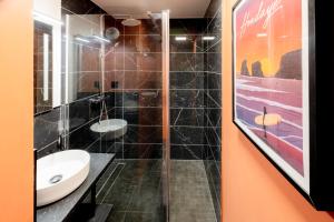 a bathroom with a sink and a shower at Outstanding Apartment-Near Disneyland Paris in Chessy