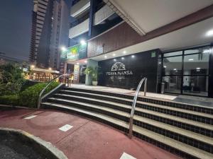 a set of stairs in front of a building at Praia Mansa Suite Hotel Flat in Fortaleza