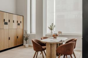 a dining room with a table and chairs at Aspasios Sofia Atocha Aparthotel in Madrid