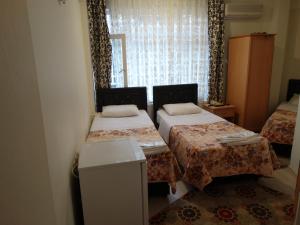 Tempat tidur dalam kamar di Hotel Efe