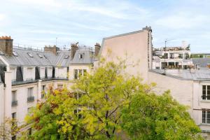 a view of buildings in a city with a tree at Atala Hotel Champs Elysées, Sonder by Marriott Bonvoy in Paris