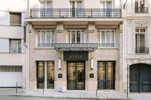a facade of a building with a atlia store at Atala Hotel Champs Elysées, Sonder by Marriott Bonvoy in Paris