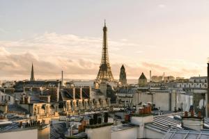 a view of a city with the eiffel tower at Atala Hotel Champs Elysées, Sonder by Marriott Bonvoy in Paris