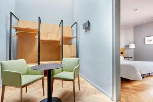 Postel nebo postele na pokoji v ubytování Le Palacete Hotel Gracia District, Sonder by Marriott Bonvoy