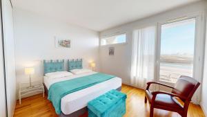 Ένα ή περισσότερα κρεβάτια σε δωμάτιο στο Villa de la Vie avec Vue Panoramique Exceptionnelles