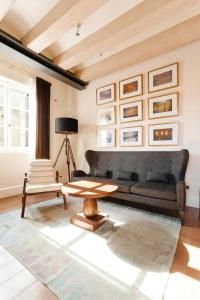 a living room with a couch and a table at DO Plaça Reial Hotel Gothic Quarter, Sonder by Marriott Bonvoy in Barcelona +37 photos