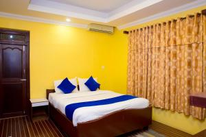 Krevet ili kreveti u jedinici u okviru objekta Tuki Resort Pokhara