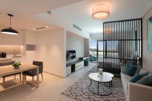 TV a/nebo společenská místnost v ubytování Millennium Executive Apartments Mont Rose