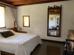 Postel nebo postele na pokoji v ubytování Hacienda Monteclaro