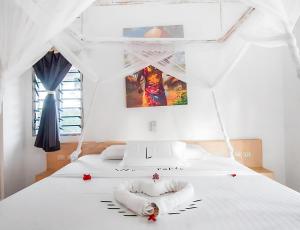 Postel nebo postele na pokoji v ubytování Nyota 11 - Jua Resort