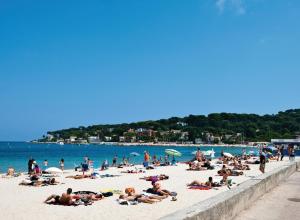 a group of people laying on a beach at Maison du bonheur in Cagnes-sur-Mer