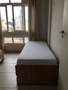 Postel nebo postele na pokoji v ubytování Flat Gostosinho