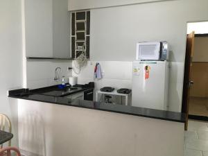 Kuchyň nebo kuchyňský kout v ubytování Flat Gostosinho