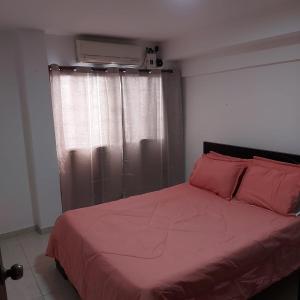 Ένα ή περισσότερα κρεβάτια σε δωμάτιο στο Moderno y familiar Apartamento