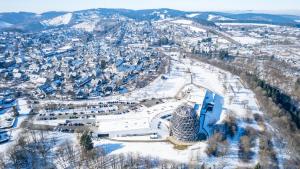 an aerial view of a city in the snow at Hotel Oversum Winterberg Ski- und Vital Resort in Winterberg