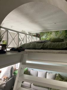 a bedroom with a bed on top of a balcony at Apartment for 5 people in Savonlinna