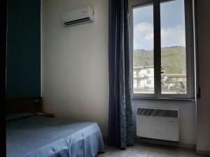 Postel nebo postele na pokoji v ubytování Hotel Santa Marta
