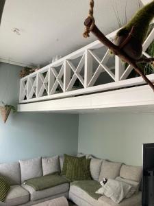 a living room with a couch and a shelf at Apartment for 5 people in Savonlinna +4 photos