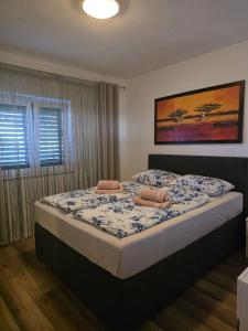 Postel nebo postele na pokoji v ubytování Apartments Ita 1