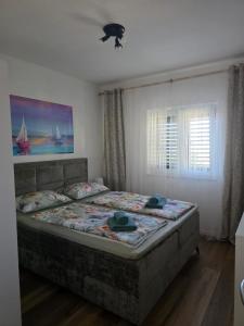Postel nebo postele na pokoji v ubytování Apartments Ita 1