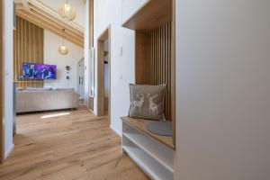 a hallway of a house with a couch and a bathroom at Ferienwohnung "Mettmatalblick" mit privater Sauna, Ühlingen-Birkendorf in Ühlingen-Birkendorf