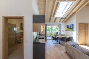 a kitchen and living room with a couch and a table at Ferienwohnung "Mettmatalblick" mit privater Sauna, Ühlingen-Birkendorf in Ühlingen-Birkendorf +27 photos