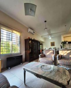 a living room with couches and a coffee table at Departamento Loteo La Plaza in Rivadavia