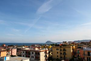 a view of a city with buildings and the ocean at Hotel Santa Marta in Pozzuoli