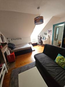 Χώρος καθιστικού στο Chambre familiale chez l'habitant