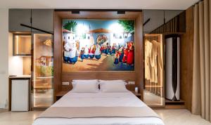 a bedroom with a large painting above a bed at 446 White Suite Luxury in Shkodër +47 photos