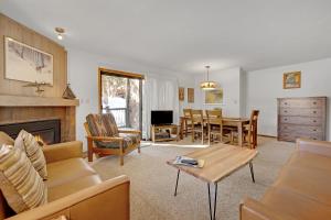 a living room with a couch and a table at Double Eagle A12 by Ski Country Resorts in Breckenridge