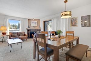 a dining room and living room with a table and chairs at Double Eagle A12 by Ski Country Resorts in Breckenridge