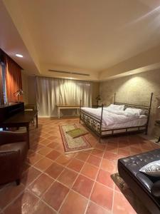 a bedroom with a bed and a piano at villa sea view in Jeddah