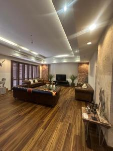 a large living room with a couch and a tv at villa sea view in Jeddah