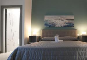 Postel nebo postele na pokoji v ubytování Borgo Alto B&B