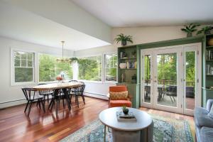 a living room with a table and chairs at Berkshire Vacation Rentals: Great Barrington Walkable To Lake And Town in Great Barrington +28 photos