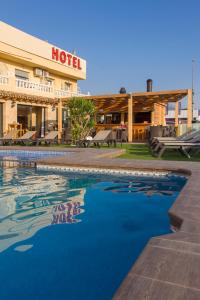 a hotel with a pool in front of a hotel at Hotel Noguera El Albir in Albir