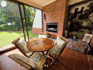 a living room with a wooden table and chairs at Villa T7 - Selborne Golf Estate in Pennington
