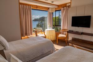 Postel nebo postele na pokoji v ubytování Hotel Elun, la mejor vista