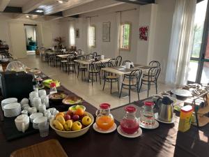 a table with fruit on it in a restaurant at Tenuta Monterosso in Feriole