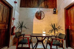 a dining room with a table and two chairs at sermest house in Urfa