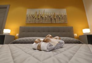 Postel nebo postele na pokoji v ubytování Borgo Alto B&B