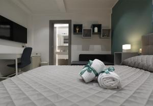 Postel nebo postele na pokoji v ubytování Borgo Alto B&B