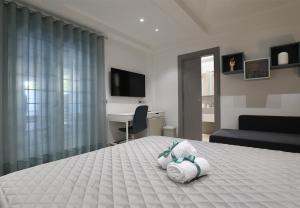 Postel nebo postele na pokoji v ubytování Borgo Alto B&B