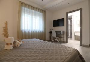 Postel nebo postele na pokoji v ubytování Borgo Alto B&B