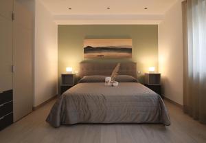 Postel nebo postele na pokoji v ubytování Borgo Alto B&B