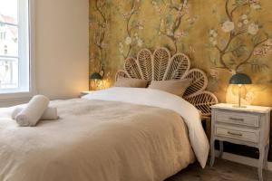 Postel nebo postele na pokoji v ubytování Authentique 2 chambres, Hyper centre, french Corner